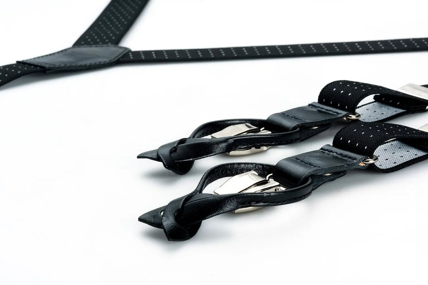 Zwarte bretels van smal elastiek met witte stipjes en zwart leer - bretels van het merk Hein Strijker